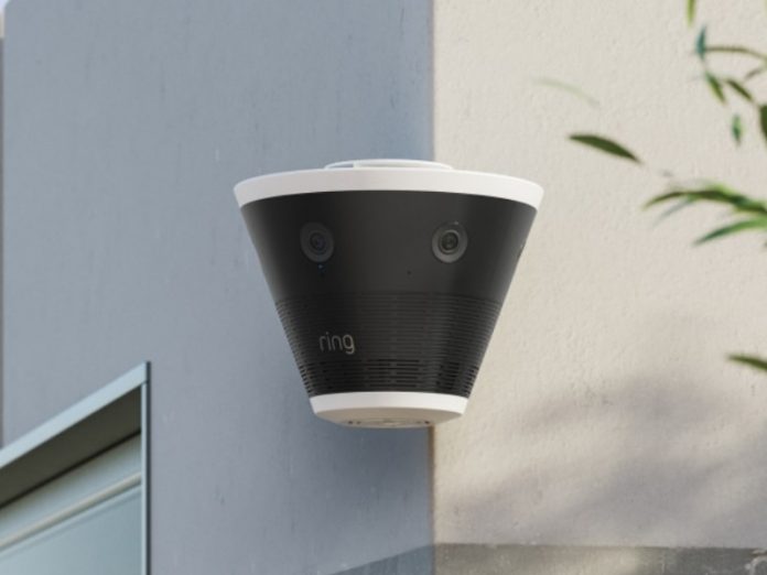 Ring Elite CES 2026, eine schwarze konische Überwachungskamera mit weißem Rand, die an einer Außenecke montiert ist und mit fünf 4K-Streams einen Blickwinkel von 270° bietet.
