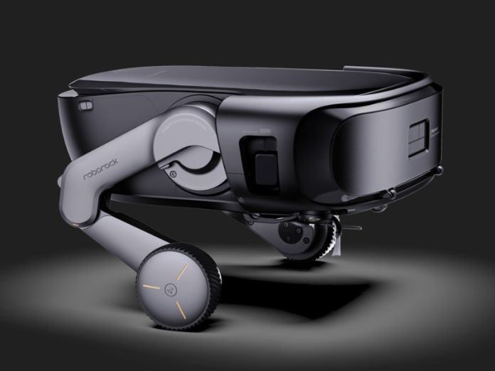 Schlanker Roborock Saros Rover, tiefschwarz und dunkelgrau, mit gelenkigen hellgrauen Beinen. Die Räder haben ein profiliertes Profil und dezente orangefarbene Lichtakzente.