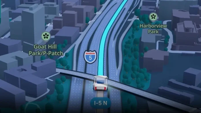 Google Maps zeigt mit dem neuen Update die Umgebung in 3D an: Ein kleines 3D-Fahrzeug fährt auf einer Autobahn mit Spurmarkierungen in der Google Maps Navigationsoberfläche.